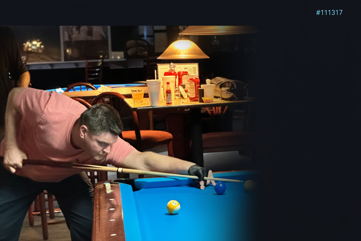 Mike Davis Jr lining up a shot at a professional pool table